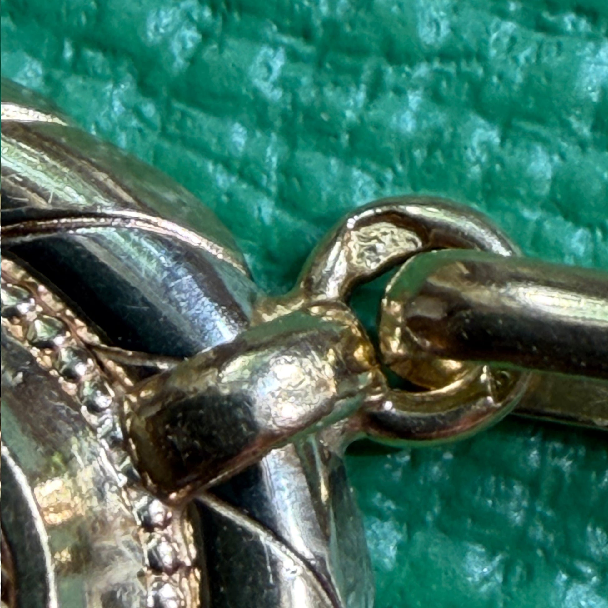Close-up of antique French 18k tricolour gold pendant showing millegrain ruby and pearl lozenge centrepiece, Second Empire circa 1875